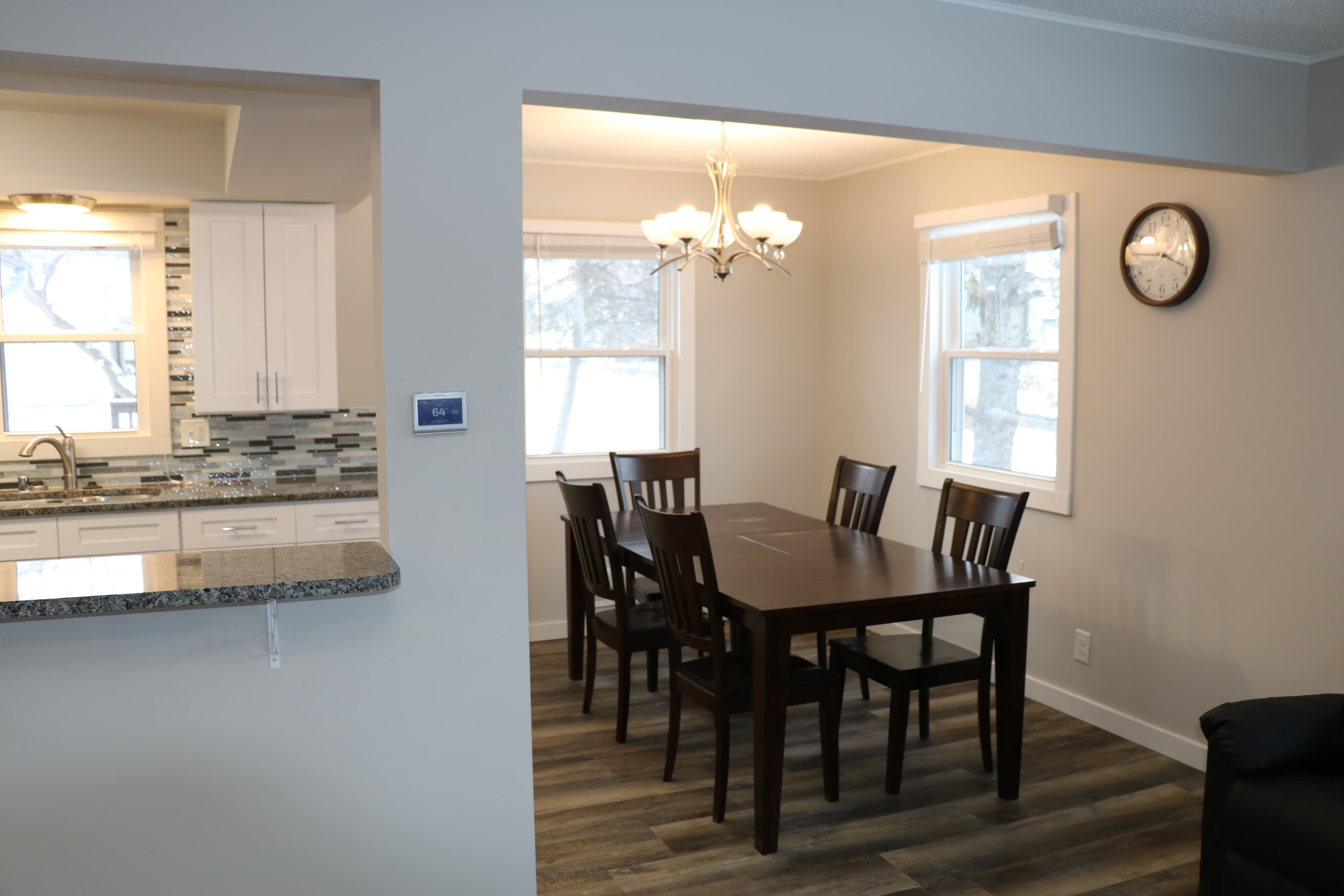 Bright dining area connected to a clean residential kitchen